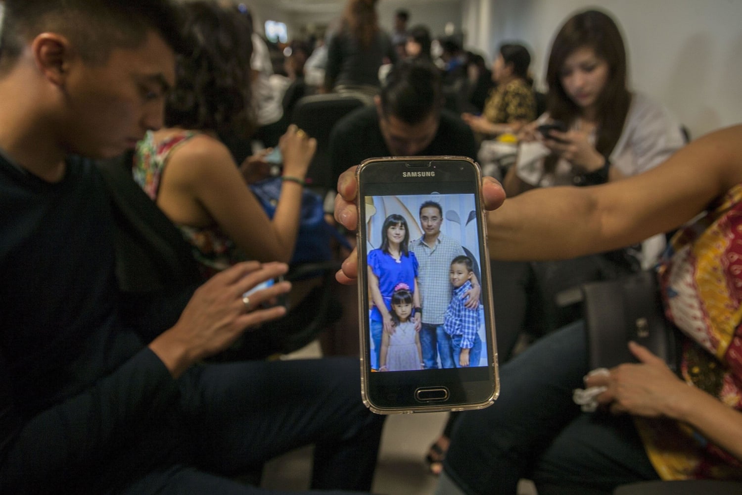 Missing AirAsia Flight QZ8501: Desperate Relatives Await News.