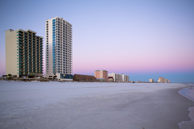 Image: the Phoenix All Suites Hotel, left, and the Island Tower condominium building in Gulf Shores, Ala.
