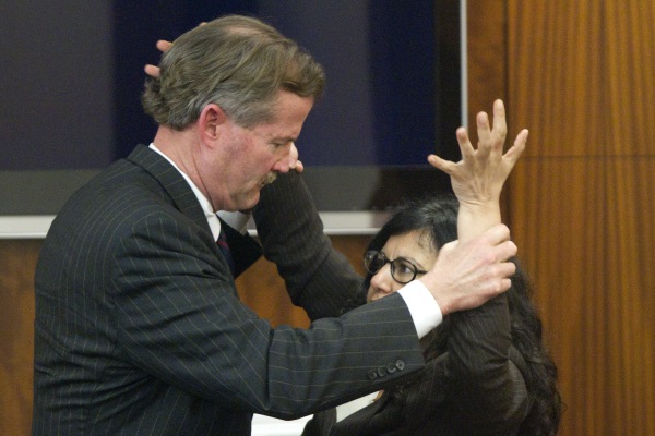 Image: Defense attorney Jack Carroll, left, and Ana Trujillo demonstrate the fight that led to a fatal stabbing as she testifies during the punishment phase of her trial 