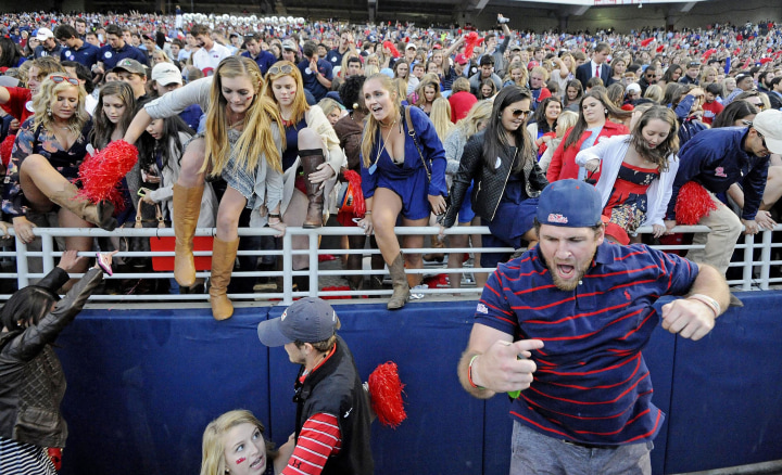 Image: Mississippi fans rush the field after an NCAA college football game in Oxford, Miss., on Oct. 4. No. 11 Mississippi beat No. 3 Alabama 23-17.