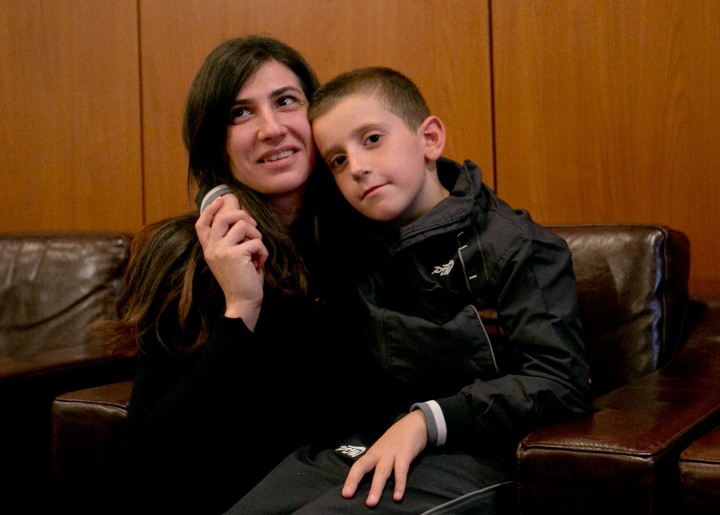 Image: Erion Zena hugs his mother Pranvera Abazi during their reunion upon his return to Kosovo's capital Pristina