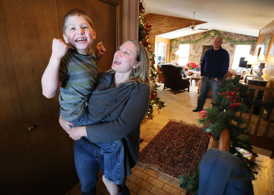 Image:  Nichole Gross plays with her son Chase, who is autistic and epileptic, at their home in Colorado Springs, Colo. Chase was moved from Chicago to Colorado so he could legally access a medical marijuana oil known as Charlotte's Web. 