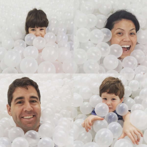Family plays in a ball pit