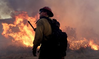 Image: A firefighter battles the Blue Cut fire near Los Angeles which has led to evacuated orders for 82,000 people.