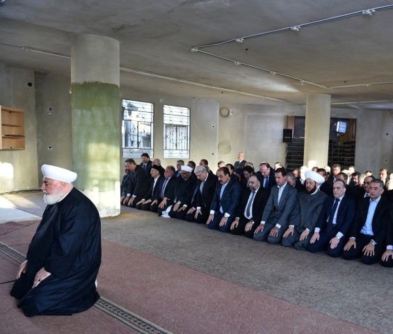 Image: Syria's president Bashar al-Assad, prays at a mosque in a Damascus suburb of Daraya