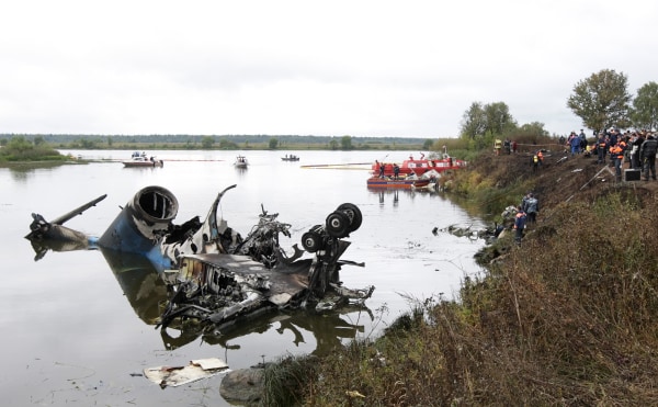 Image: Russian investigators work after 2011 plane crash