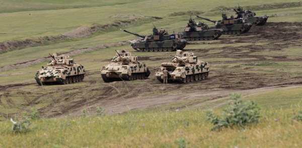 Image: U.S. Bradley infantry fighting vehicles and M1A2 Abrams tanks