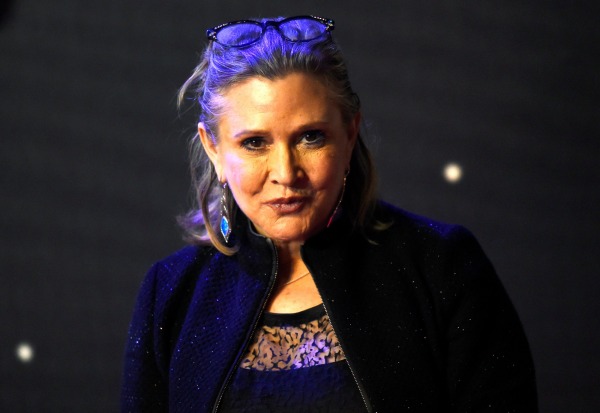 Image: Carrie Fisher poses for cameras as she arrives at the European Premiere of Star Wars, The Force Awakens in Leicester Square, London