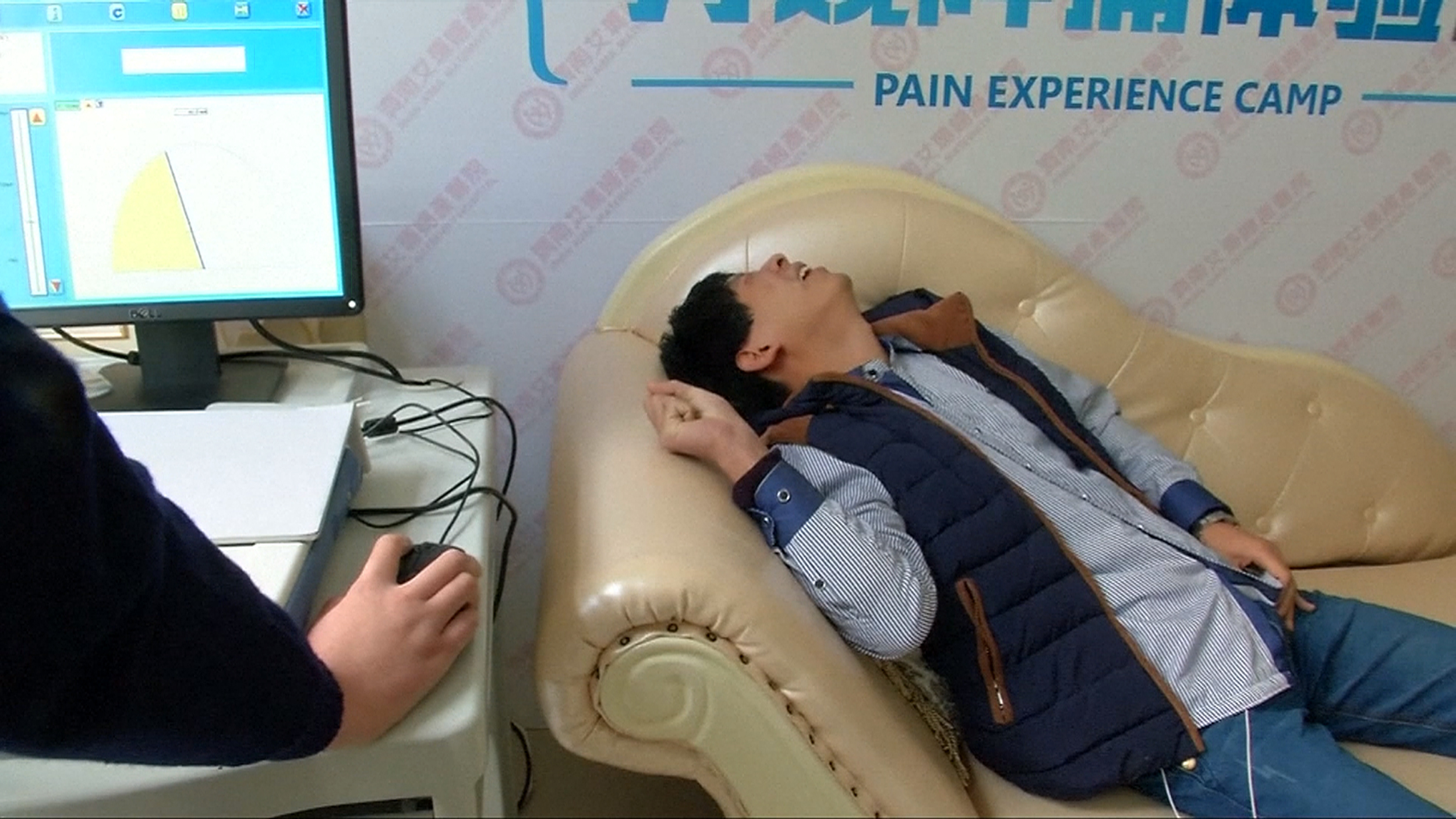 The reaction of a man who experiences the pain of childbirth with a birth  simulator