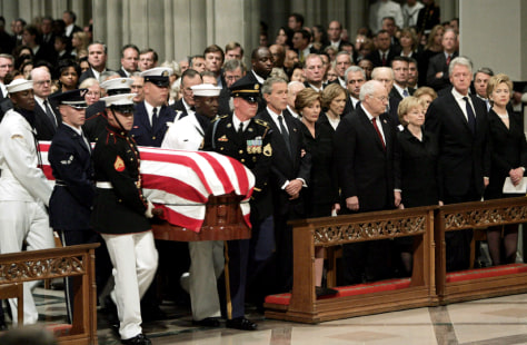 IMAGE: The casket of former President Ronald Reagan is carried inside Washington National Cathedral. 