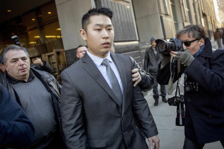 Image: NYPD officer Peter Liang departs the criminal court after an arraignment hearing in the Brooklyn borough of New York City