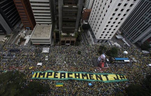 Image: Demonstrators take part in a protest to demand the resignation of Brazilian President Dilma Rousseff