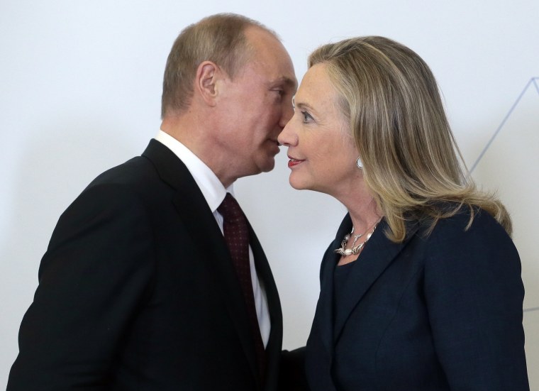 Russian President Vladimir Putin welcomes U.S. Secretary of State Hillary Clinton 