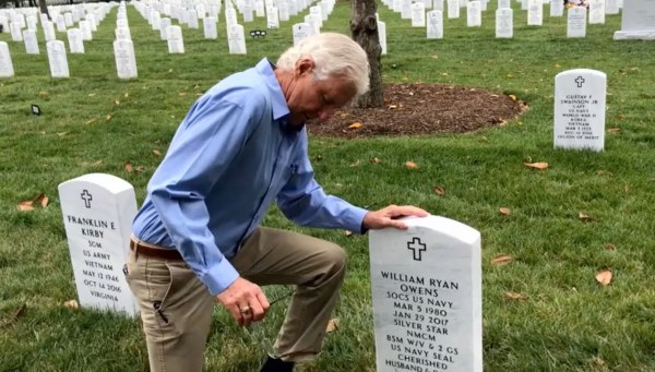 Image: Bill Owens kneels at the gravestone of his son, Ryan Owens.