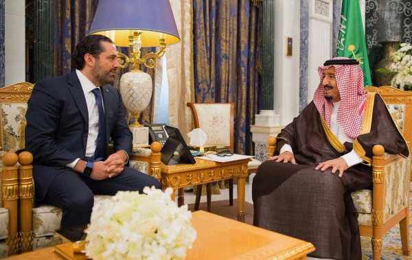 Image: Saudi King Salman, right, meets with outgoing Lebanese Prime Minister Saad Hariri in Riyadh
