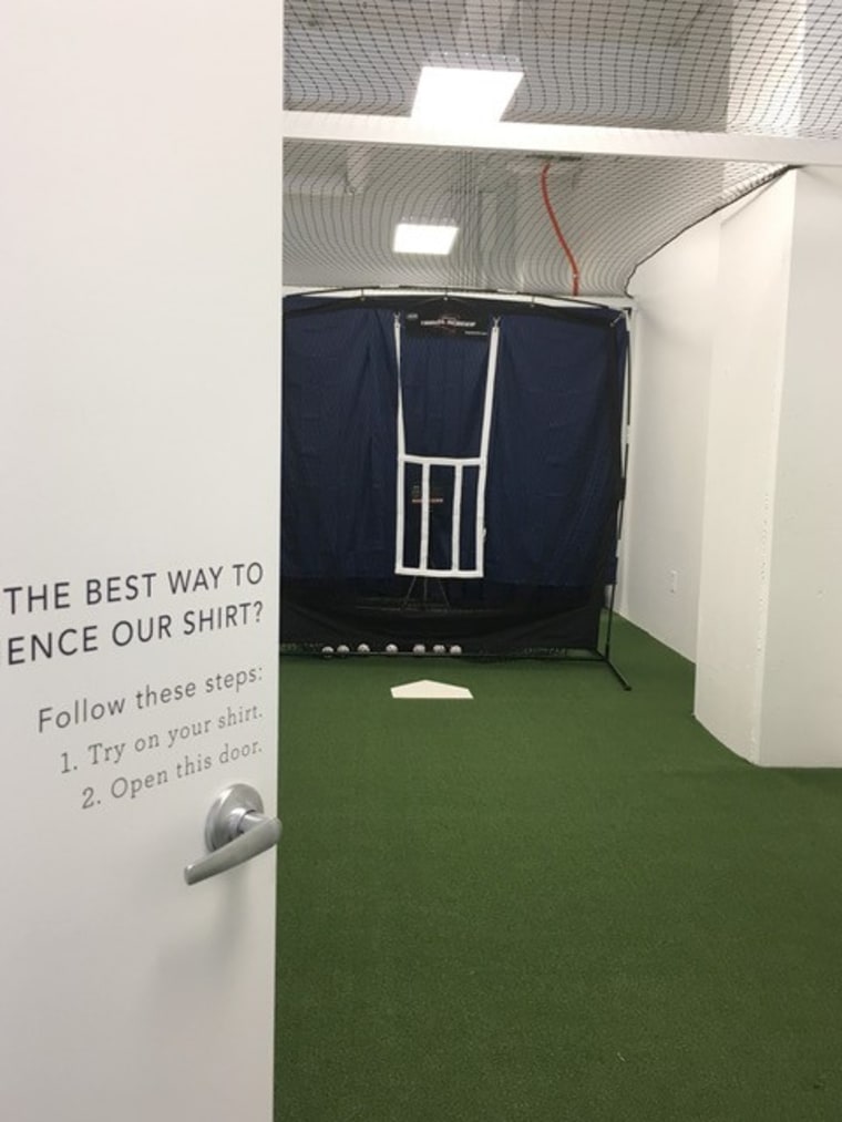 A secret passageway in the dressing room at Mizzen+Main allows customers to try out the sweat-wicking shirts.