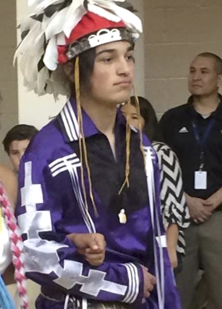 Thomas Kanewakeron Gray walks in a procession during his high school graduation at Santa Fe Indian School in Santa Fe, New Mexico, on May 26, 2016.