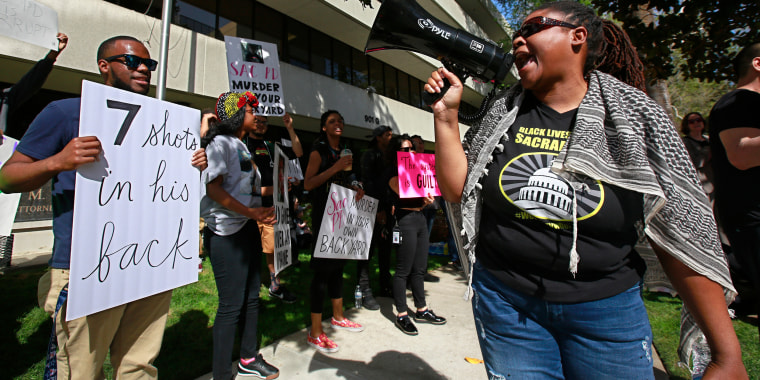 Protesters call for the indictment of police officers involved in the shooting death of Stephon Clark in Sacramento, California.