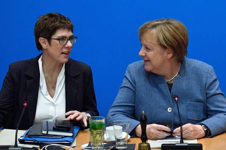 Image: German Chancellor and leader of the Christian Democratic Union Angela Merkel and Annegret Kramp-Karrenbauer talk during a party leadership meeting in Berlin