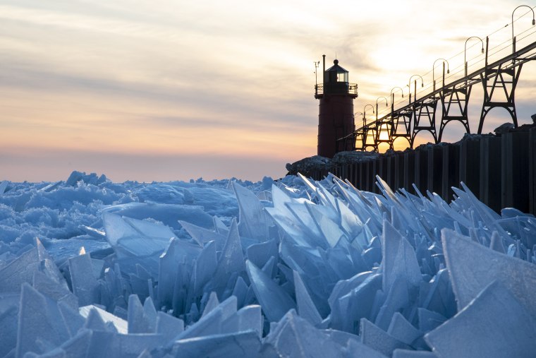 Frozen Lake Michigan thaws into crazy looking blue ice shards