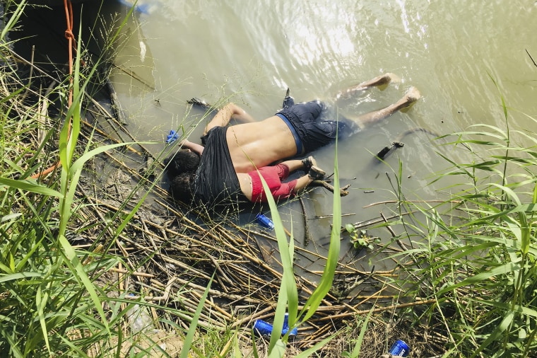 The bodies of Salvadoran migrant Oscar Alberto Martinez Ramirez and his nearly 2-year-old daughter Valeria lie on the bank of the Rio Grande in Matamoros, Mexico on June 24, 2019, after they drowned trying to cross the river to Brownsville, Texas. Martinez' wife, Tania told Mexican authorities she watched her husband and child disappear in the strong current.