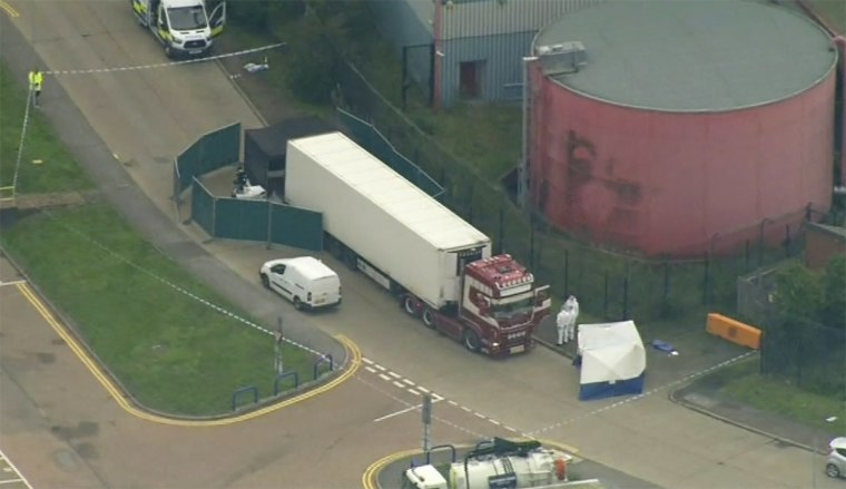 Image: An aerial view as police forensic officers attend the scene after a truck was found to contain a large number of dead bodies in Essex, South England