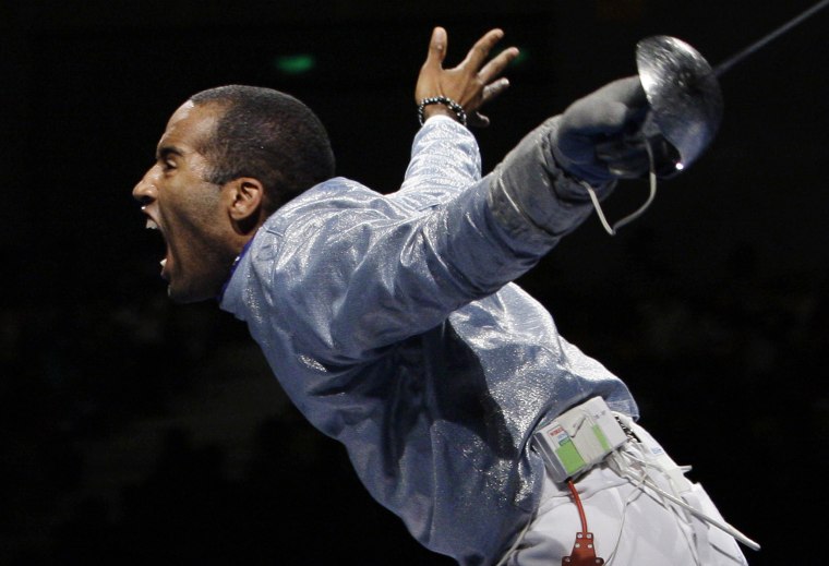 Keeth Smart celebrates after defeating Russia 45-44 in the semifinals of the men's team saber in fencing during the Beijing 2008 Olympics.