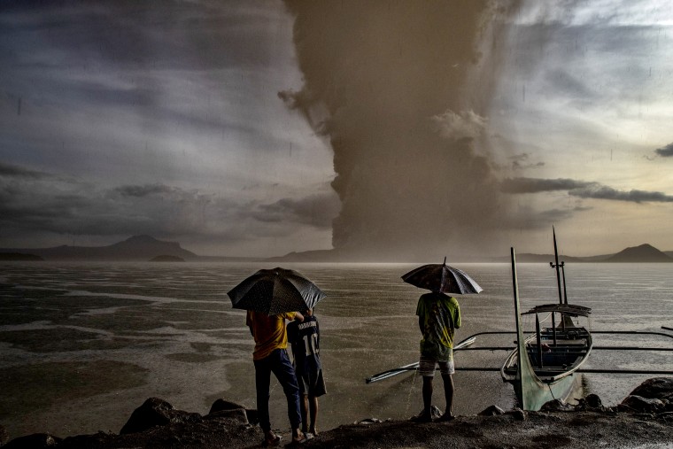 Image: Residents look at Taal Volcano eruption near Talisay in the Philippines on Jan. 12, 2020.