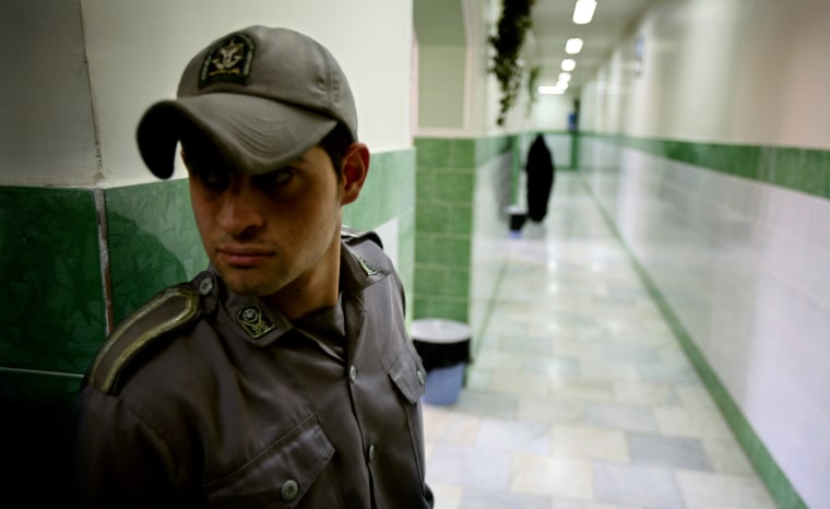 Image: Prison guard stands along corridor in Tehran's Evin prison