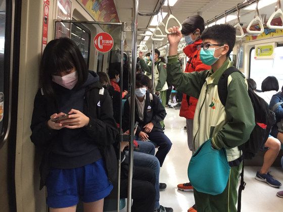 Image: Commuters travel on the subway in Taiwan.