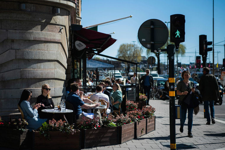 Image: People have lunch at a restaurant in Stockholm, during the coronavirus COVID-19 pandemic on April 22, 2020.