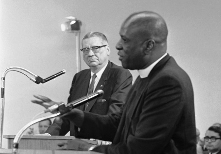 Image: Rev. Theodore Gibson, right, active in fostering smooth interracial relations in Miami, Fla., tells the Miami City Commission he favors strong action against crime, Dec. 30, 1967. He added he believed Miami Police Chief Walter Headley, left,