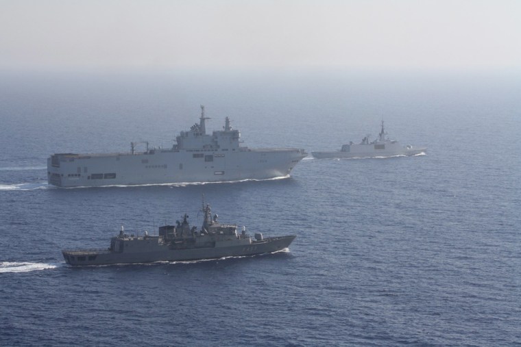 Image: Greek and French vessels sail in formation during a joint military exercise in Mediterranean sea