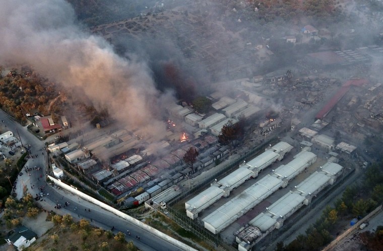 Image: Fire burns container houses and tents in the Moria refugee camp on the northeastern Aegean island of Lesbos, Greece