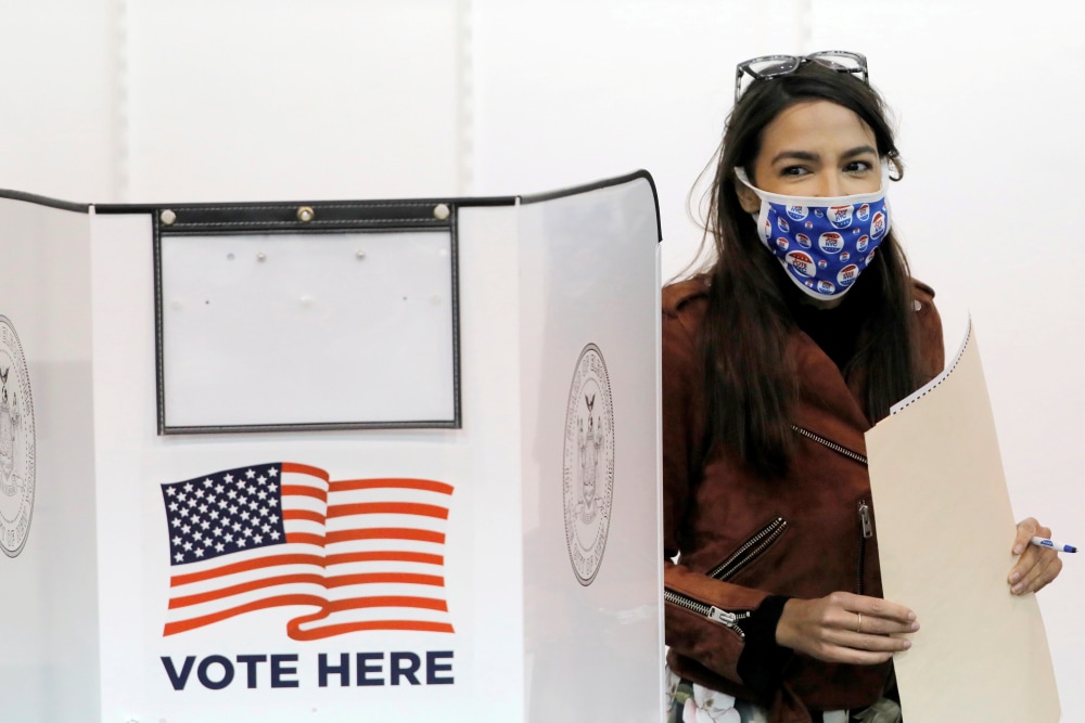 Rep. Alexandria Ocasio-Cortez, D-N.Y., votes early at a polling station in The Bronx on Oct. 25