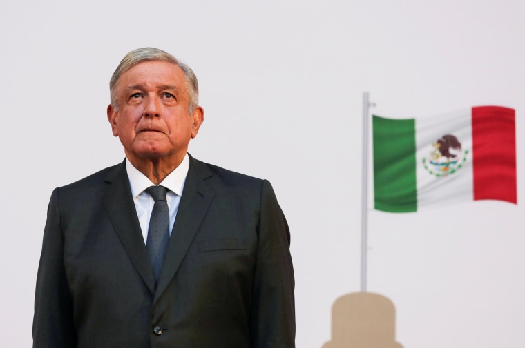 Image: Mexico's President Andres Manuel Lopez Obrador listens to the national anthem after addressing the nation on his second anniversary as the President of Mexico, at the National Palace in Mexico City