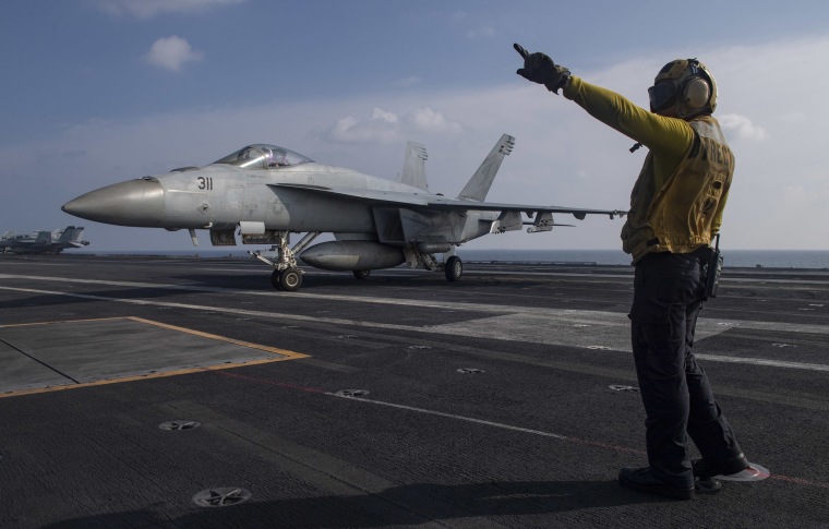 Image: An F/A-18E Super Hornet on the flight deck of the aircraft carrier USS Nimitz in the Arabian Sea last week.